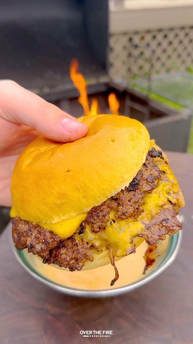 Instagram post by @overthefirecooking for Oklahoma Joe's. Caption reads: Oklahoma Onion Burger with @oklahomajoes #ad....