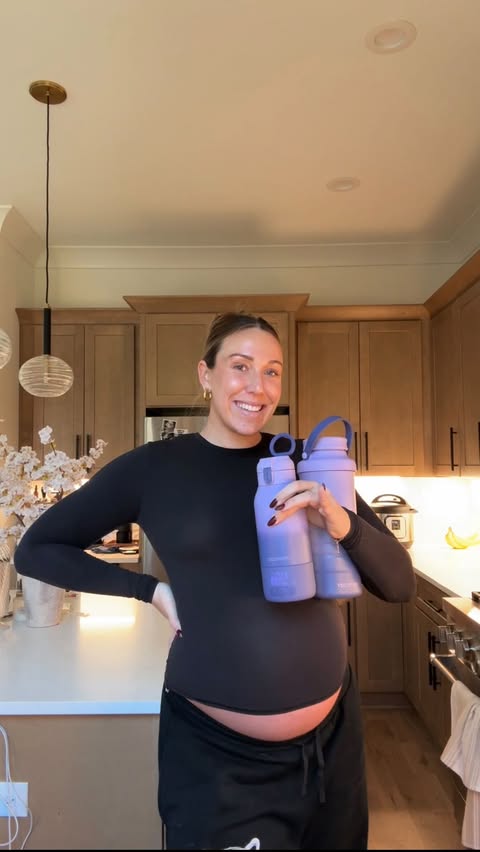 Instagram post by @abbeyweitzeil for Momcozy. Caption reads: 34 weeks with baby boy 🩵 and @momcozy has all the....