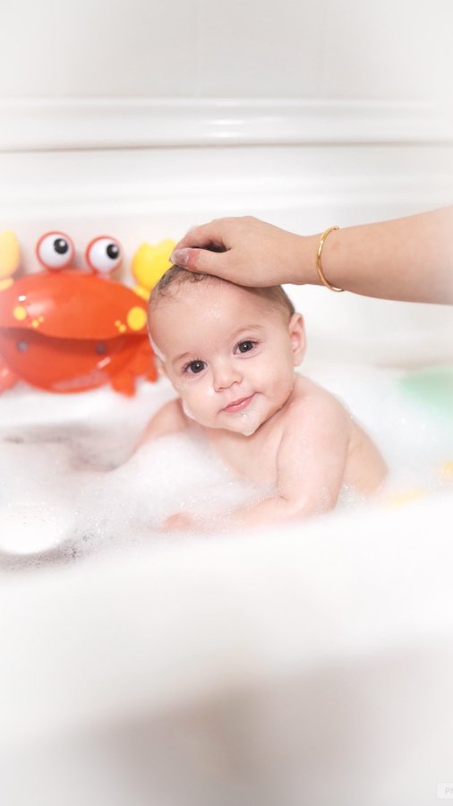 Instagram post by @simplyesrag for Moshi Kids. Caption reads: [...] such a struggle, but with the @playmoshikids....