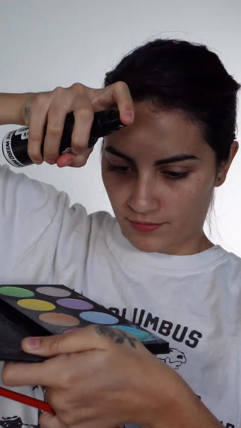 Instagram post by @youngforevermakeup for Mehron Makeup. Caption reads: Oil painting makeup inspired 🎨 usando....