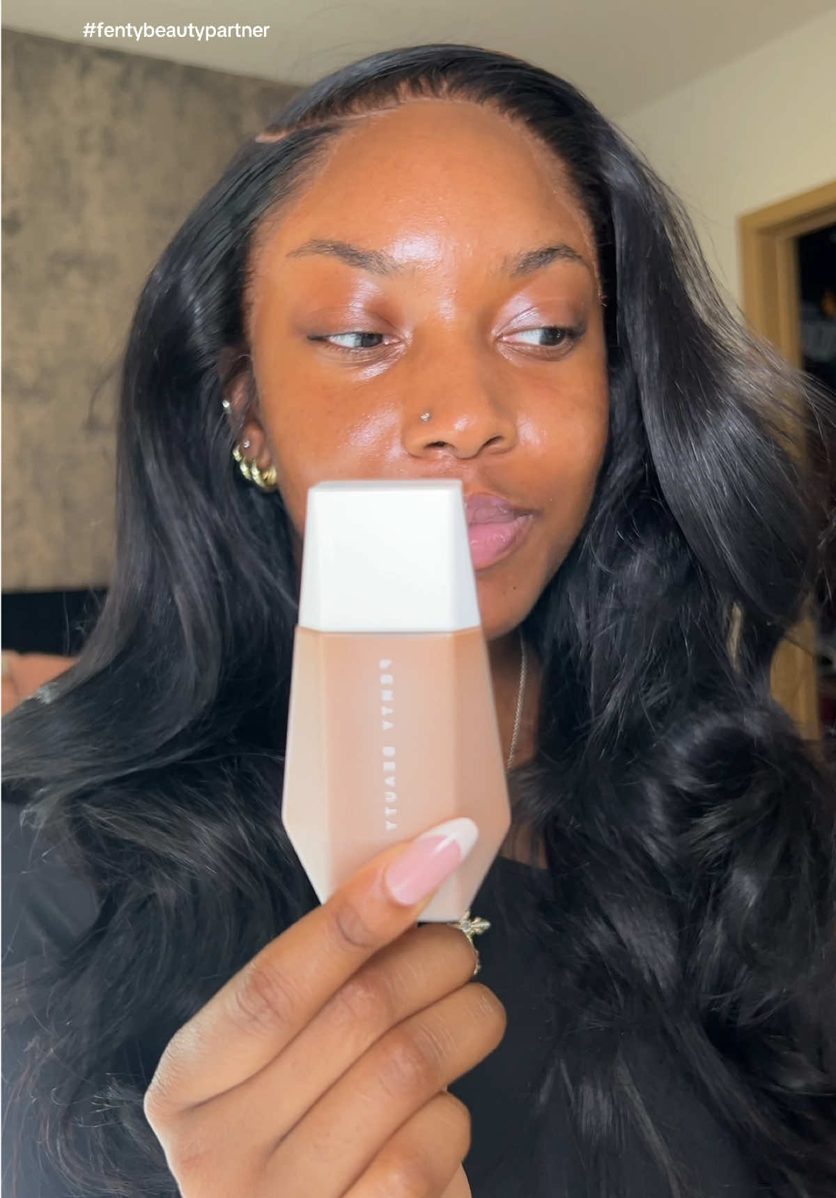 TikTok post by @ajerrrrrrrr for Fenty Beauty. Caption reads: reaching for skin tints all summer🌞 @Fenty Beauty....