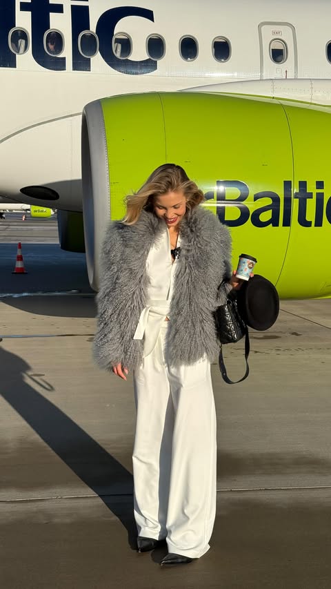 Instagram post by @lovavavilova for airBaltic. Caption reads: [...] flight aesthetics by @airbaltic ☁️....