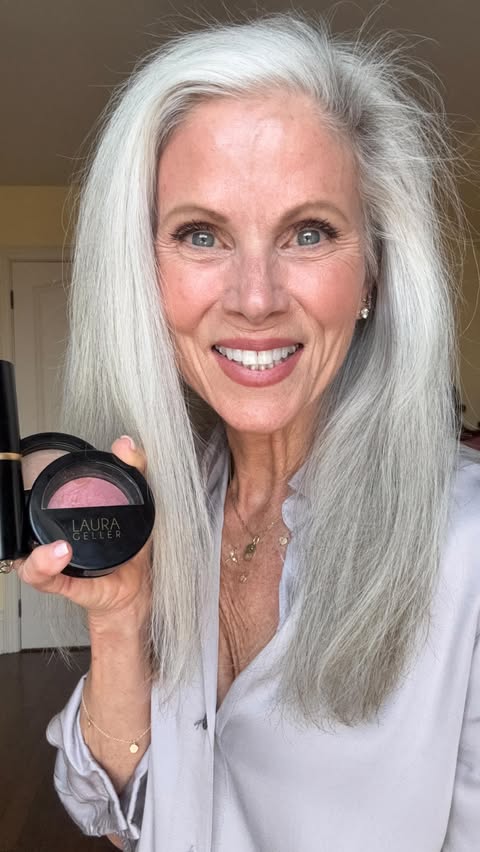 Instagram post by @whitehairwisdom for Laura Geller Beauty. Caption reads: The Laura Geller Beauty 40+ Club Kit = your....