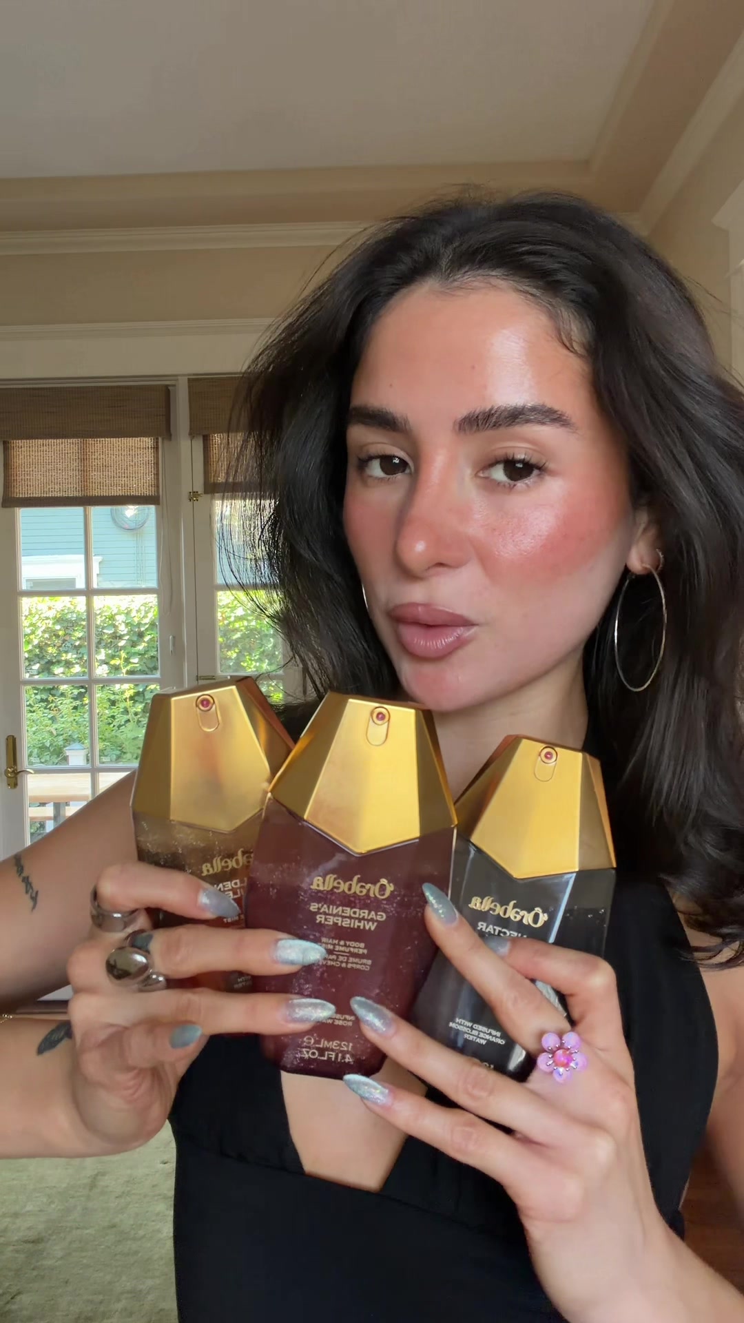TikTok post by @anibaaaby for Orebella. Caption reads: picking a scent for a night out ⋆.ೃ࿔*:･@'Ôrəbella....