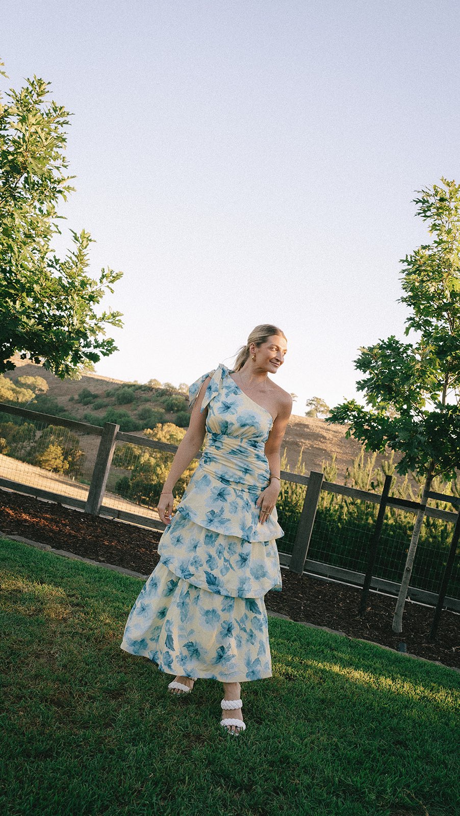 Instagram post by @livewithelle for Gingham and Heels. Caption reads: [...] in this gorgeous dress from @ginghamandheels....