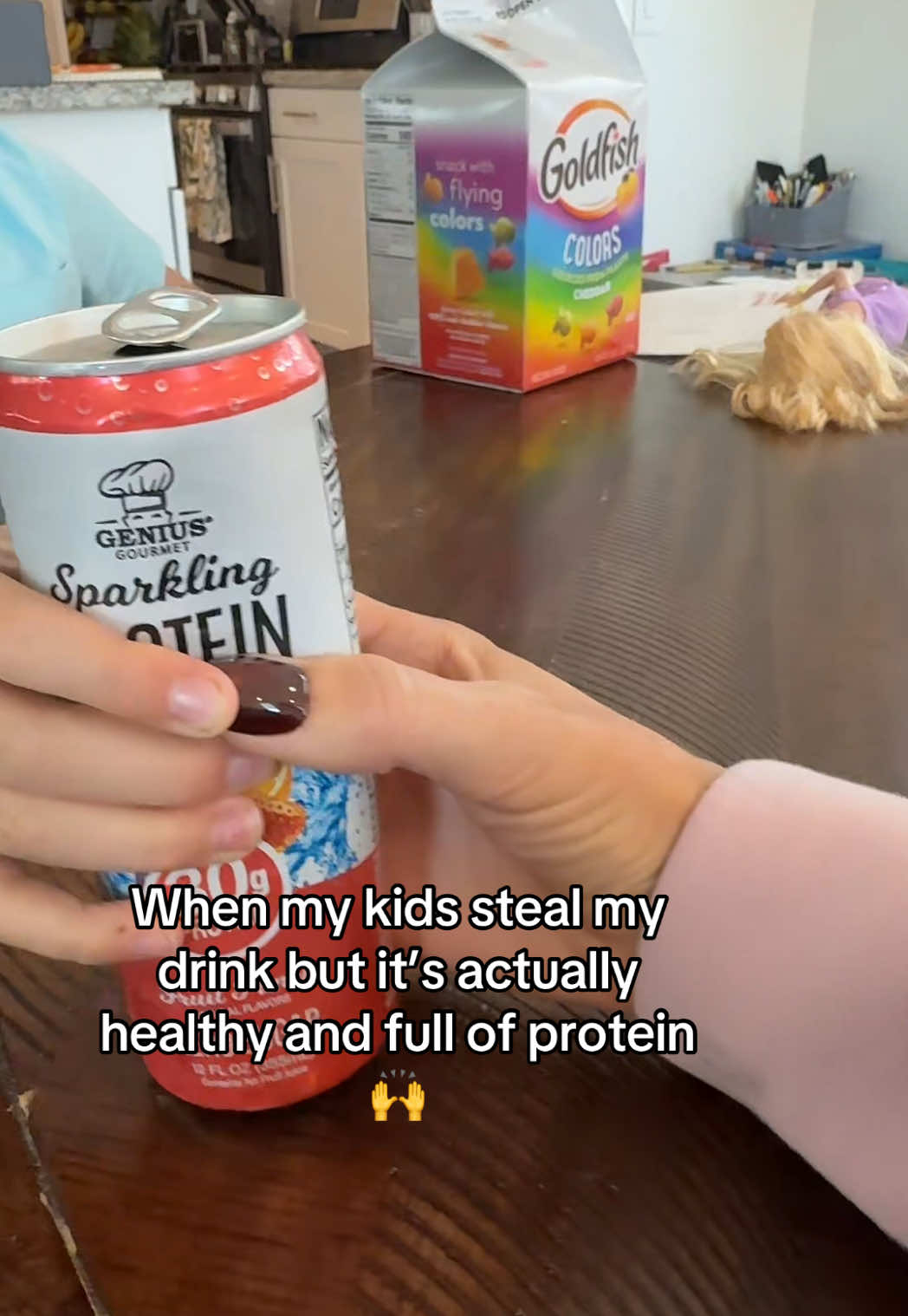 TikTok post by @erinwood.sahm for Genius Gourmet. Caption reads: [...] 🤣 #protein #mom #proteinhack #kids....