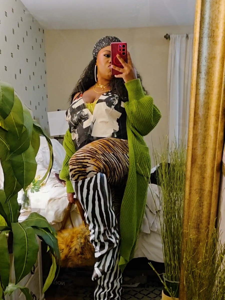 TikTok post by @brittbratstyles for Meshki. Caption reads: Mixing Animal Prints 🪞🦓🦊 #boots #akira....