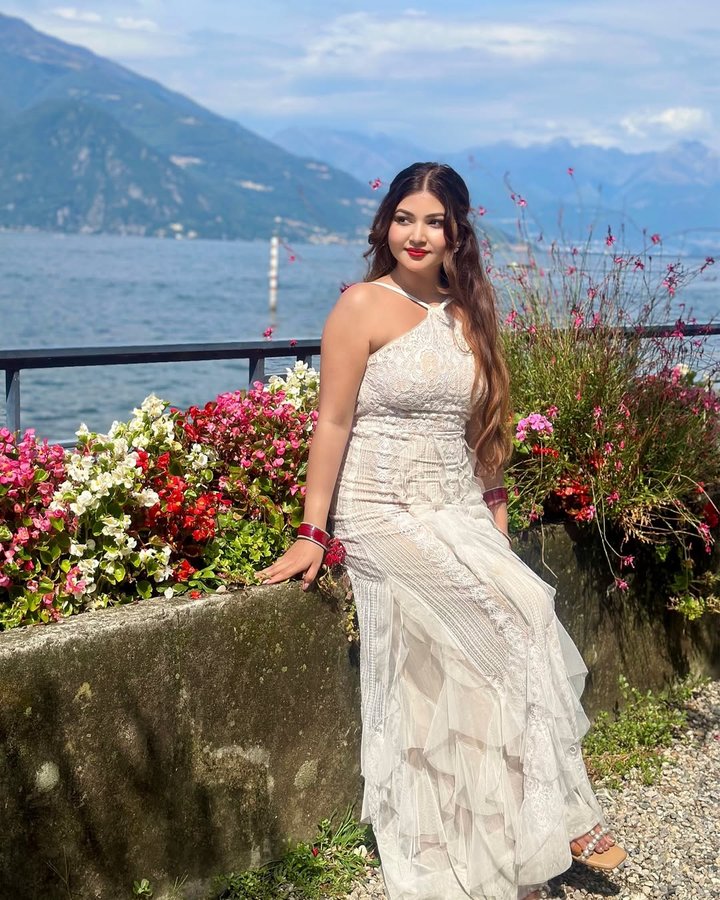 Instagram post by @rose_rawat for BCBGMAXAZRIA. Caption reads: I want this feeling back.🕊️ #lakecomo #europe....