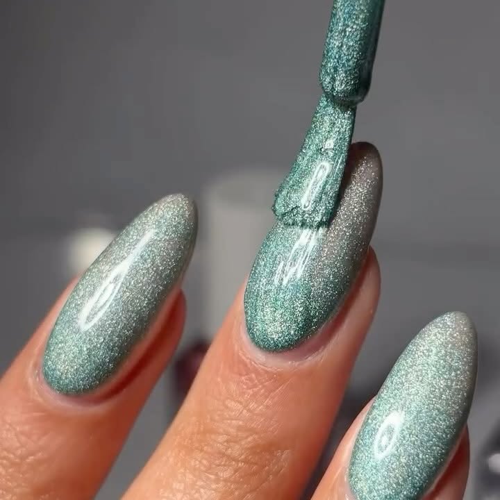 Instagram post by @nailsbyk_x for Barry M. Caption reads: Swatches of the new @barrymcosmetics holochrome....