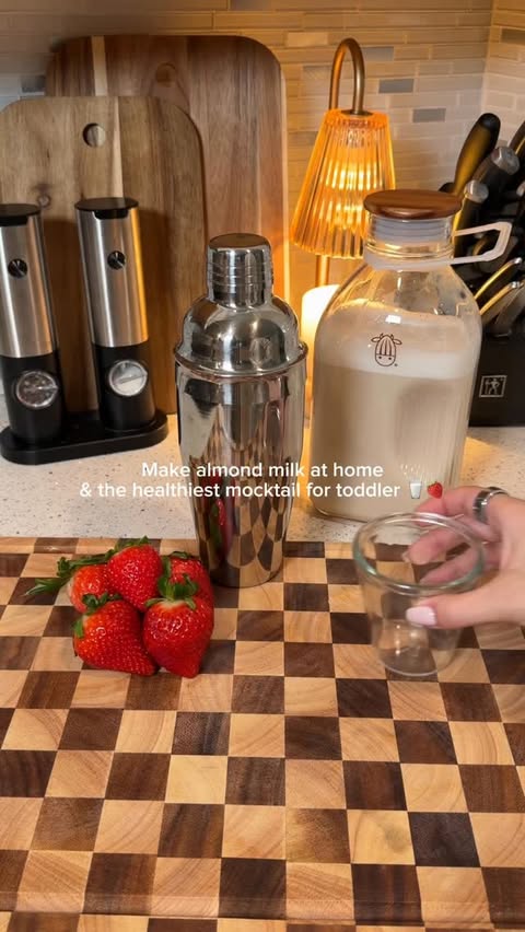 Instagram post by @alimomlife for Almond Cow. Caption reads: I will never buy almond milk at the store again....