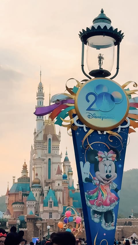 Instagram post by @keikeiandlewis for Hong Kong Disneyland. Caption reads: AD | Come spend the day with us at @hkdisneyland....