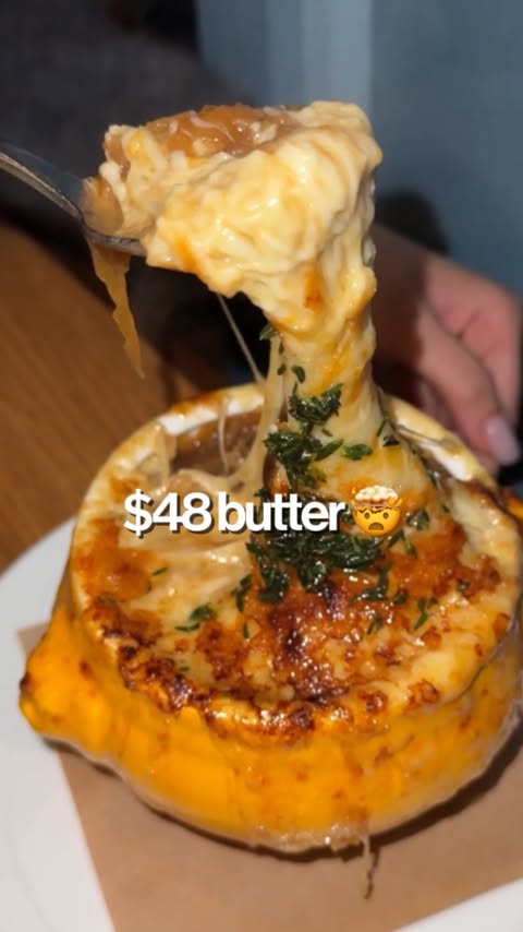 Instagram post by @vivecachow for Noshinku. Caption reads: Trying the famous table side butter 🤯 (Noshinku....