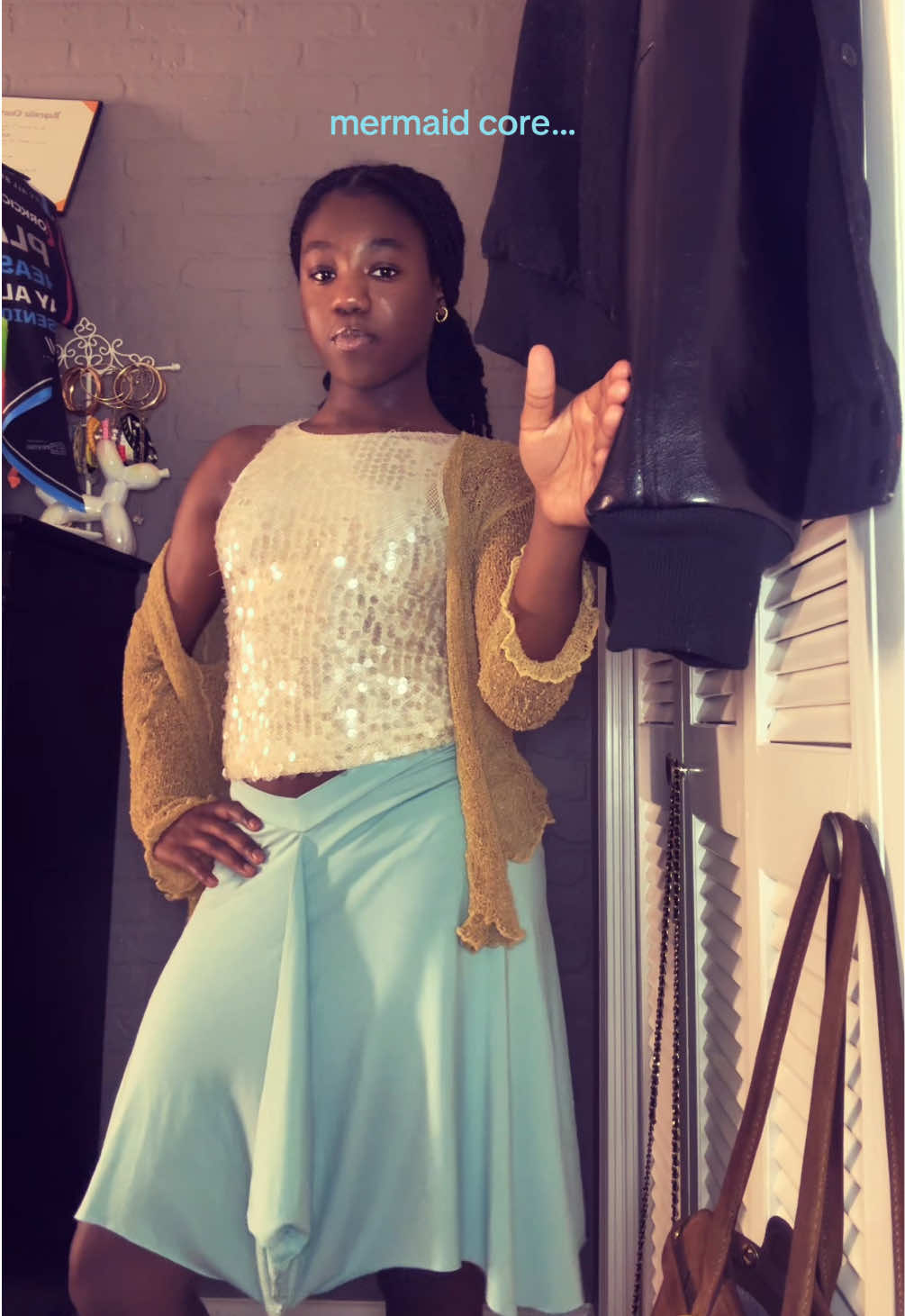 TikTok post by @_taylor505_ for Motel Rocks. Caption reads: LOVE this skirt😭 @MOTEL #motelrocks #midiskirt....