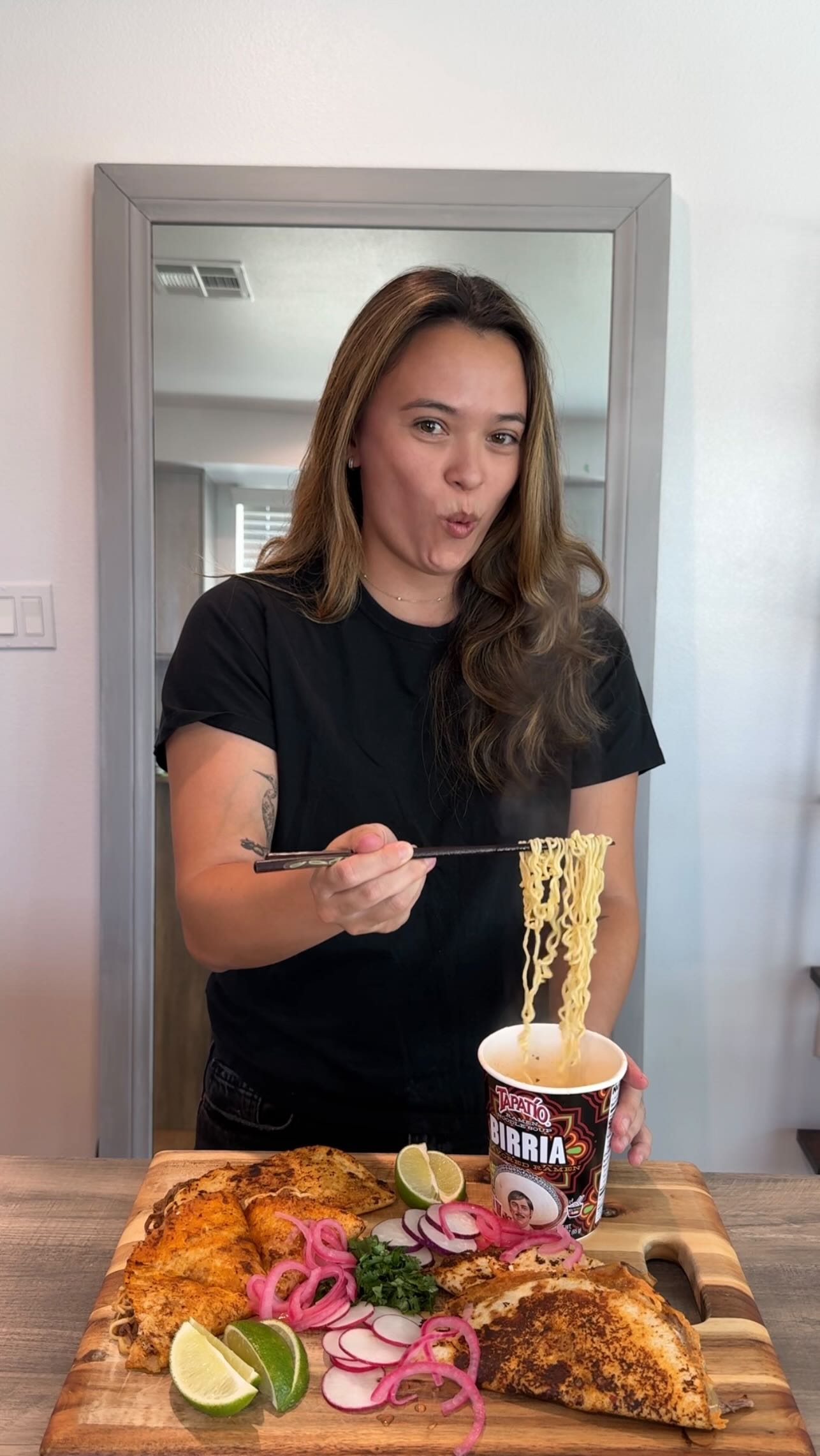 Instagram post by @raelyn_cs for Tapatio Ramen. Caption reads: Birria ramen quesadilla dip 🍜🌮 Cheesy, spicy,....