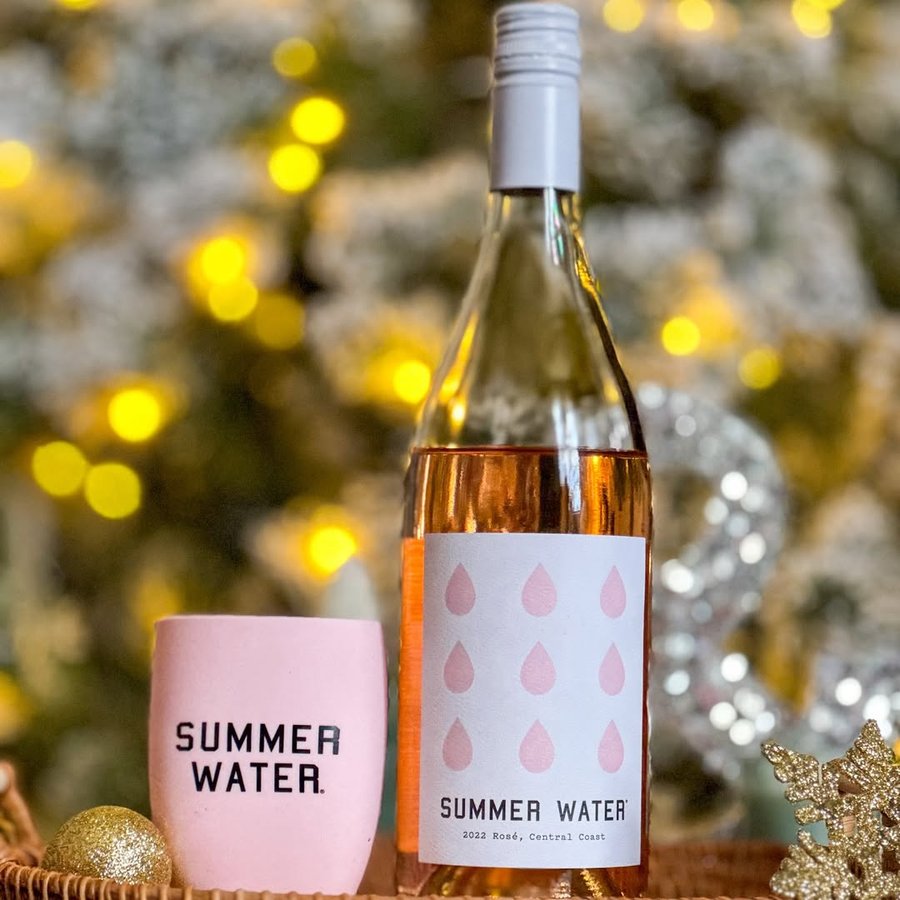 Instagram post by @simplytasheena for Summer Water. Caption reads: msg21+🎄✨ Who says rosé is just for summer?....
