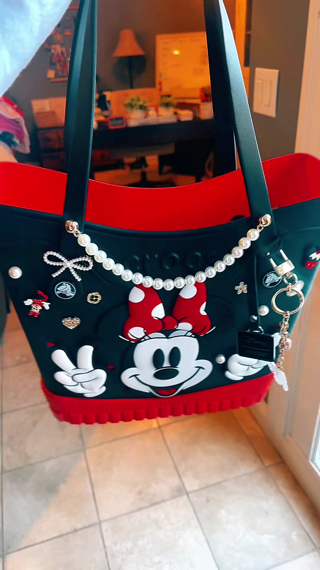 TikTok post by @adrianegweyn for Crocs. Caption reads: [...] Grab it before they sell out! ❤️🖤❤️🖤....