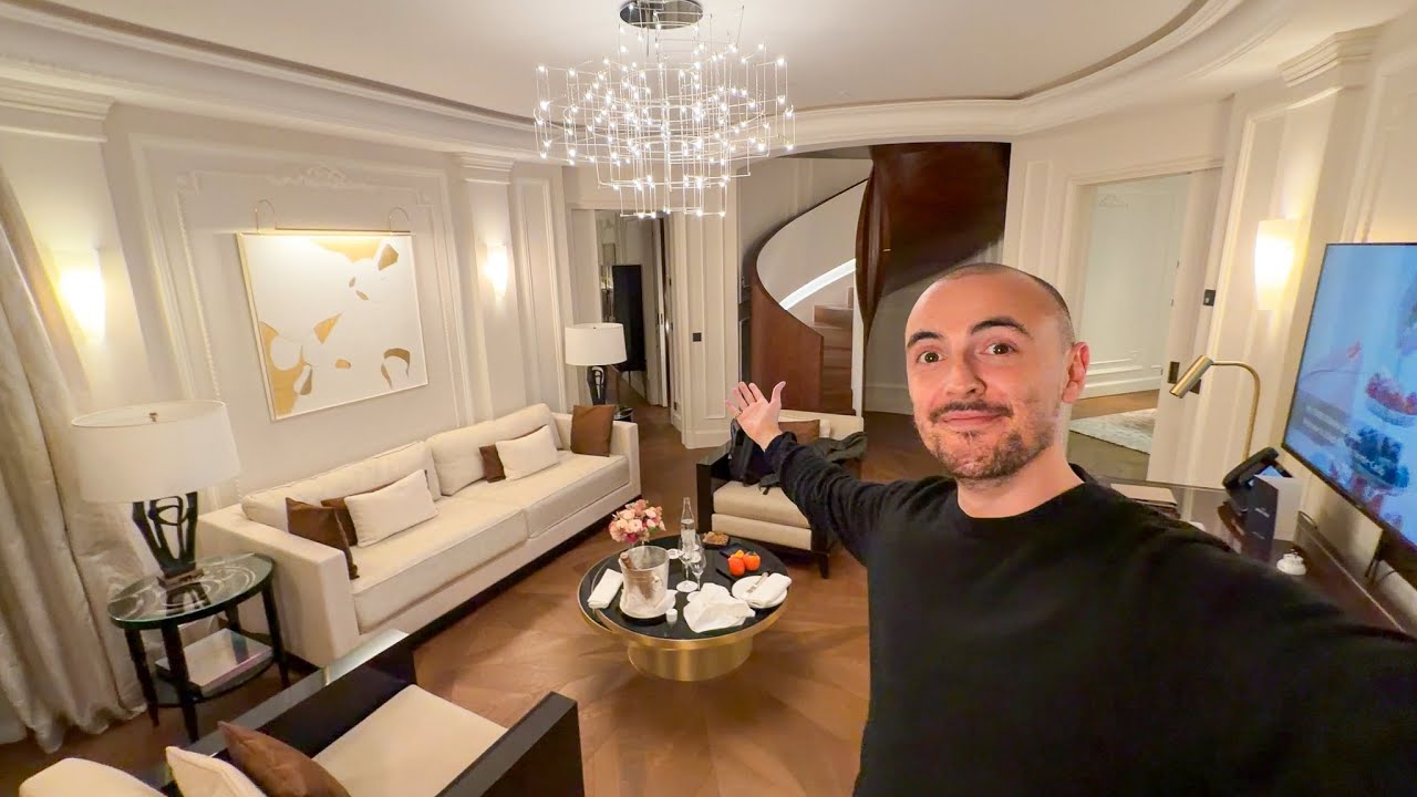 YouTube post by @surrealpower for Crypto.com. Caption reads: My €3,000 per night suite at the Hotel du Paris in....