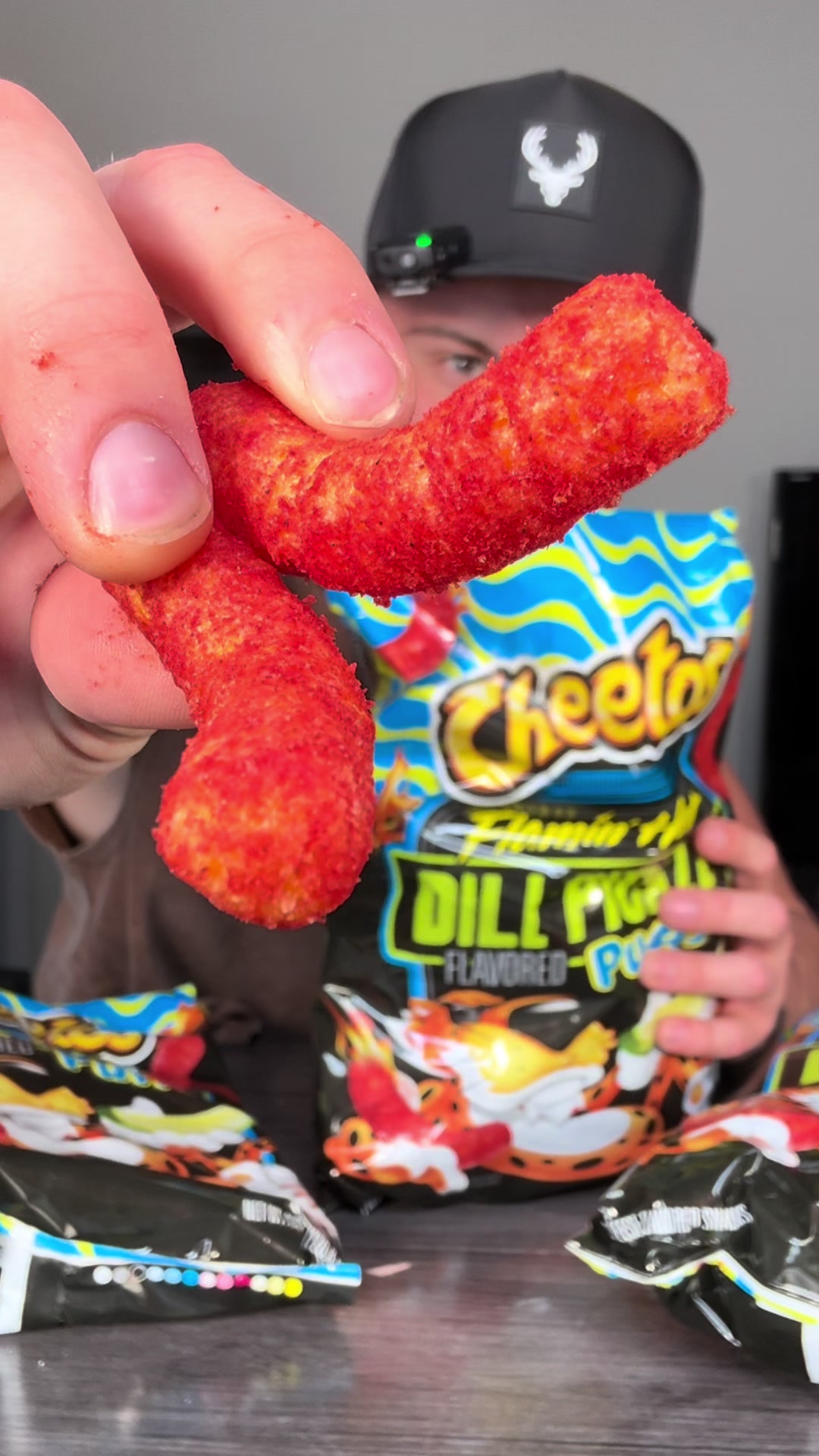 TikTok post by @getthesedeals for Frito-Lay. Caption reads: [...] #flaminghotcheetos #dillpickle #snacks....
