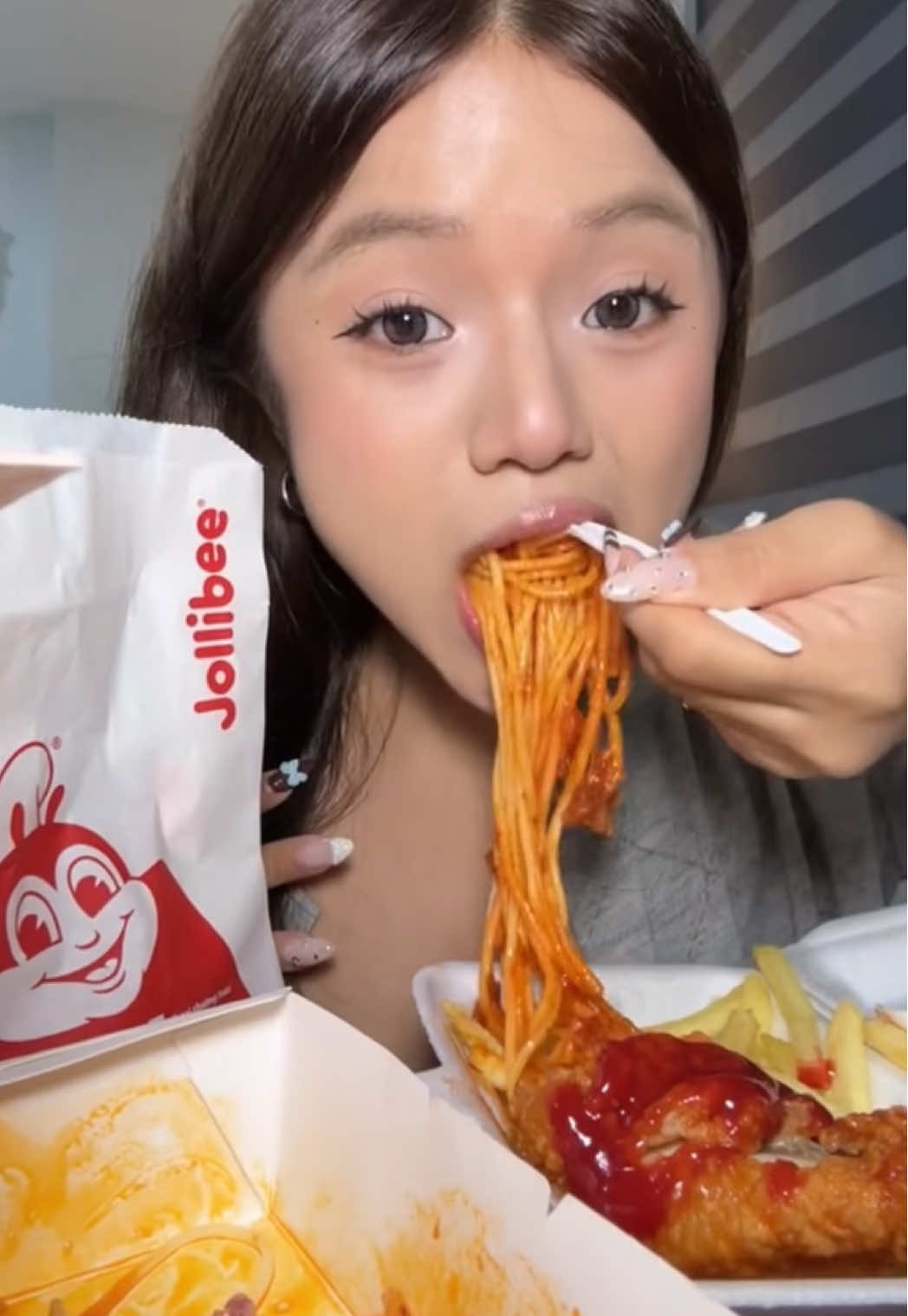TikTok post by @j.chatae for Jollibee. Caption reads: @Jollibee  I need you in Thailand right....