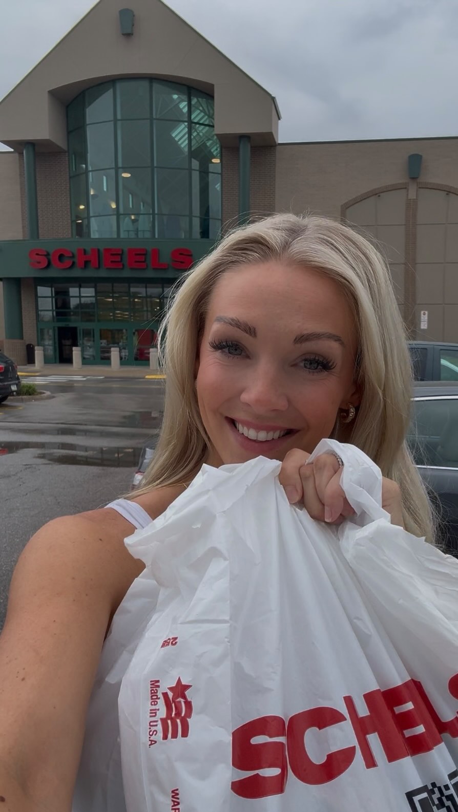 Instagram post by @lauravandeberg_ for SCHEELS. Caption reads: So pumped to partner with @iowacityscheels again....