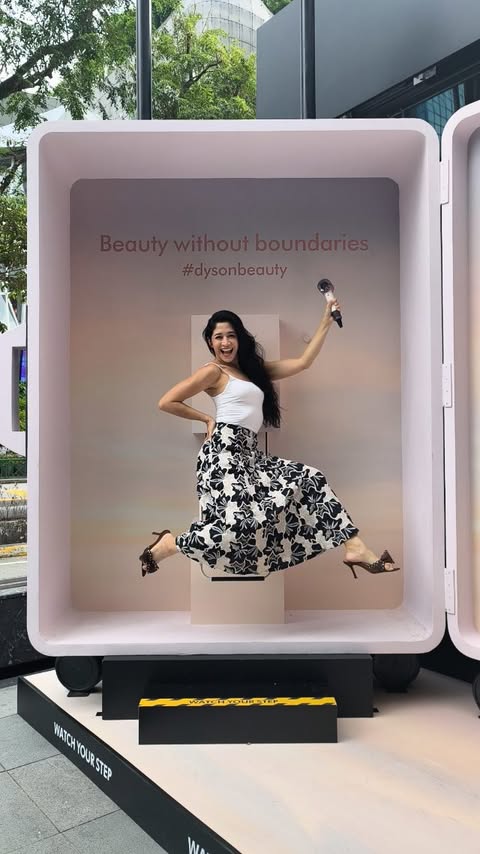 Instagram post by @munahbagharib for Dyson Beauty. Caption reads: [...] voltage! Japan ✓ Taiwan ✓ USA ✓ #DysonBeauty....