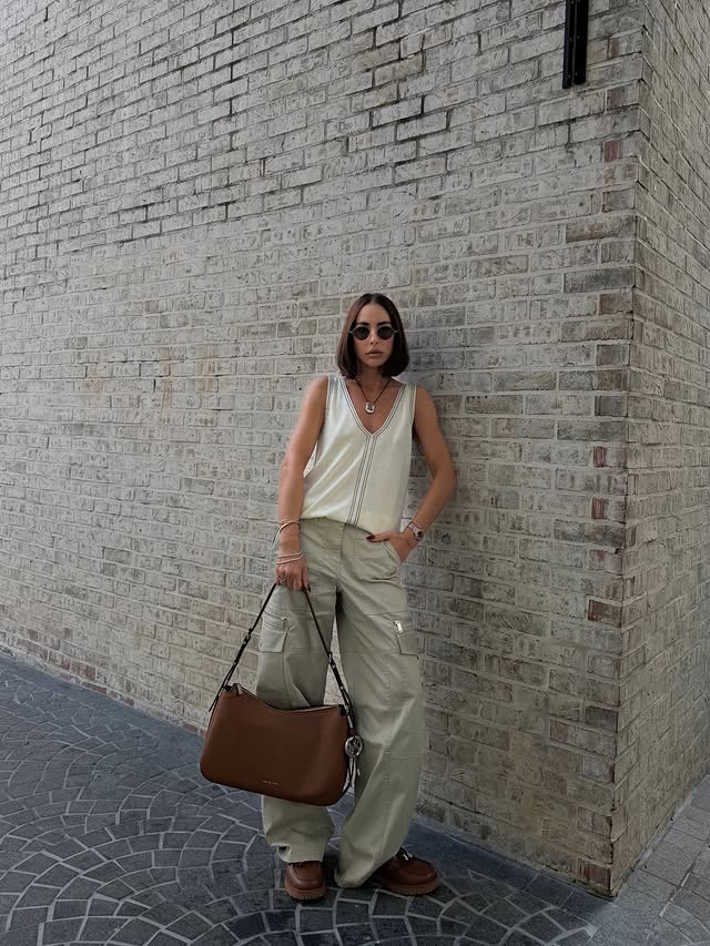 Instagram post by an influencer for Michael Kors. Caption reads: resort ease, city attitude. @michaelkors....