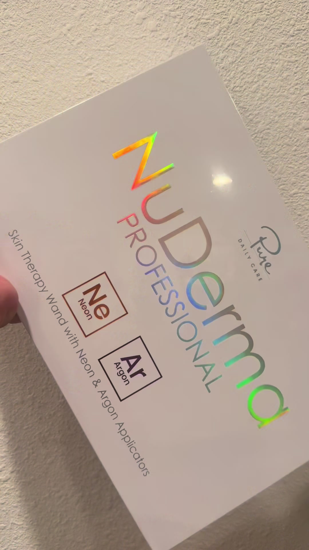 TikTok post by @simplymarlyn2 for Pure Daily Care NuDerma Wand. Caption reads: [...] and gives that spa glow @Pure Daily Care....