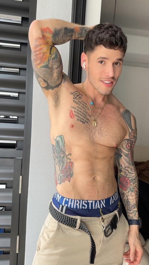 Instagram post by @xaviern11 for Andrew Christian. Caption reads: Bailemos 💙🔥

@andrewchristianintl.