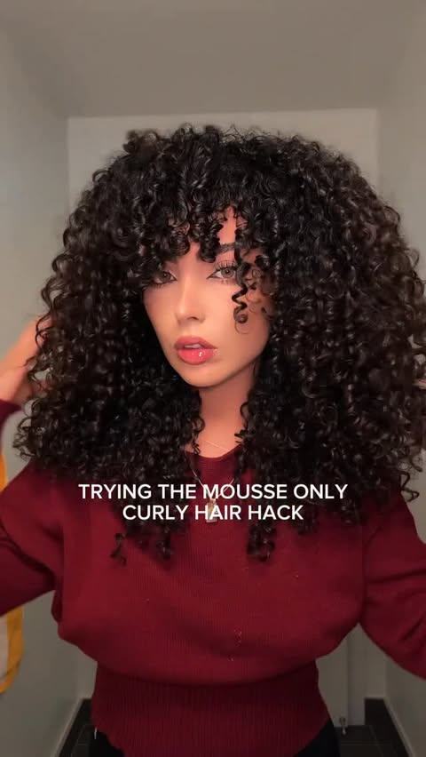 Instagram post by @moon.azad for DESIGNME Hair. Caption reads: [...] viral mousse only curly hack using....
