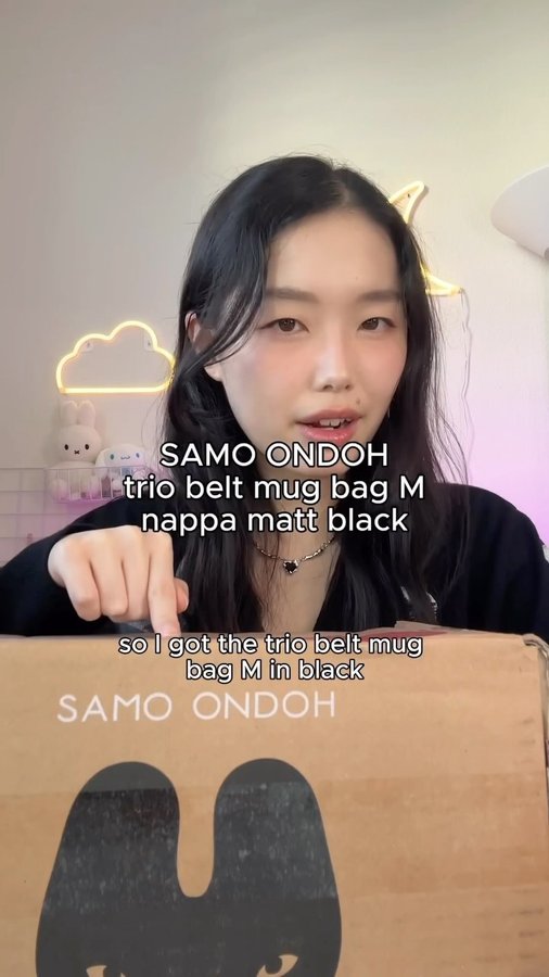 Instagram post by @ninaeyu for SAMO ONDOH. Caption reads: @samo_ondoh unboxing 🖤 trio belt mug bag M nappa....