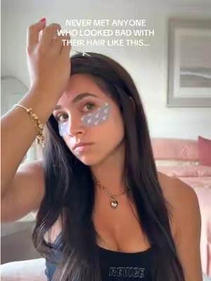 TikTok post by @itsadrinamax for Emi Jay. Caption reads: [...] @K18 Hair @rhode skin @Dae Hair @Emi Jay....