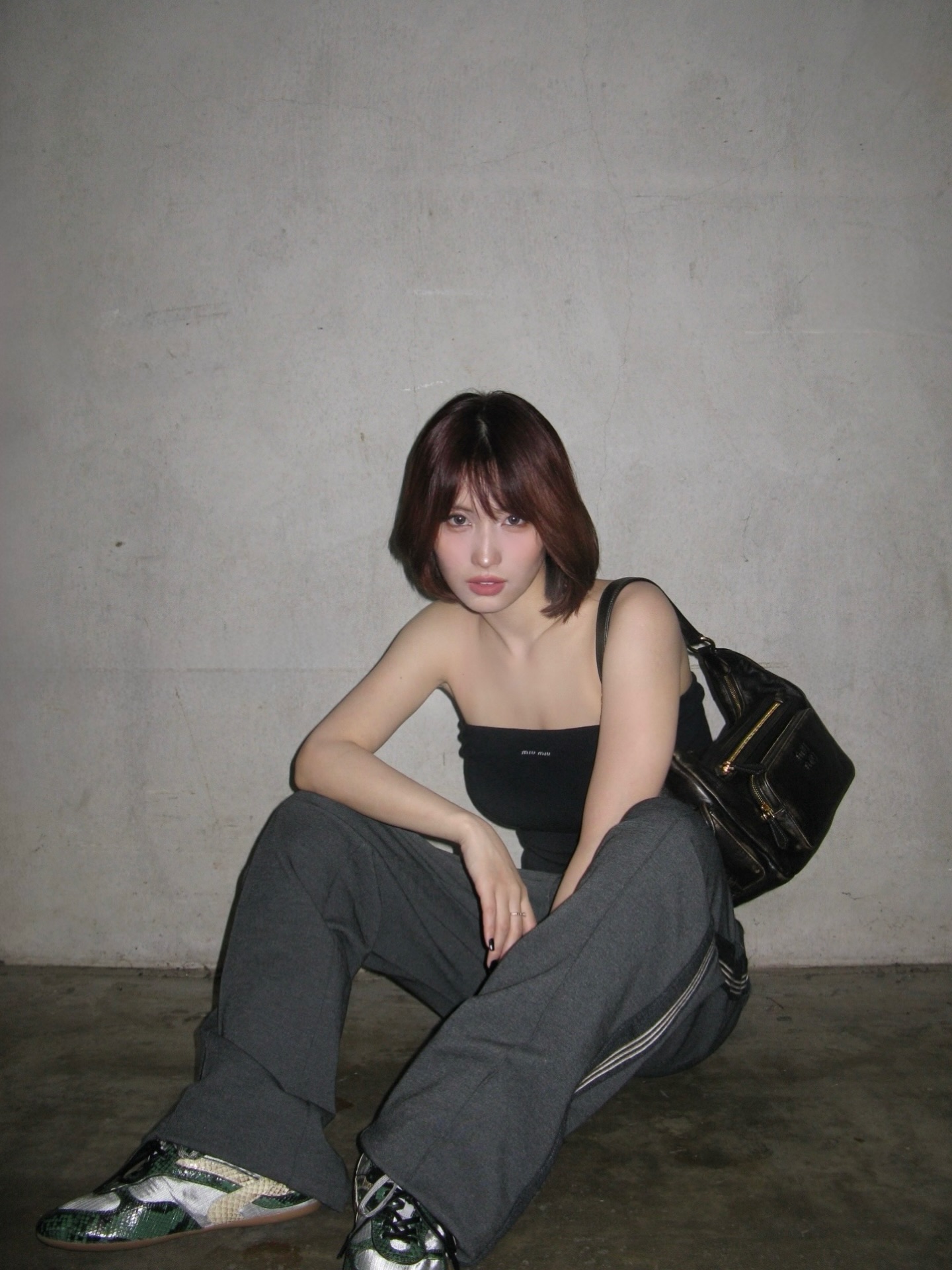 Instagram post by @momo for Miu Miu. Caption reads: My favorite Pocket Bag and sneakers from Miu Miu....