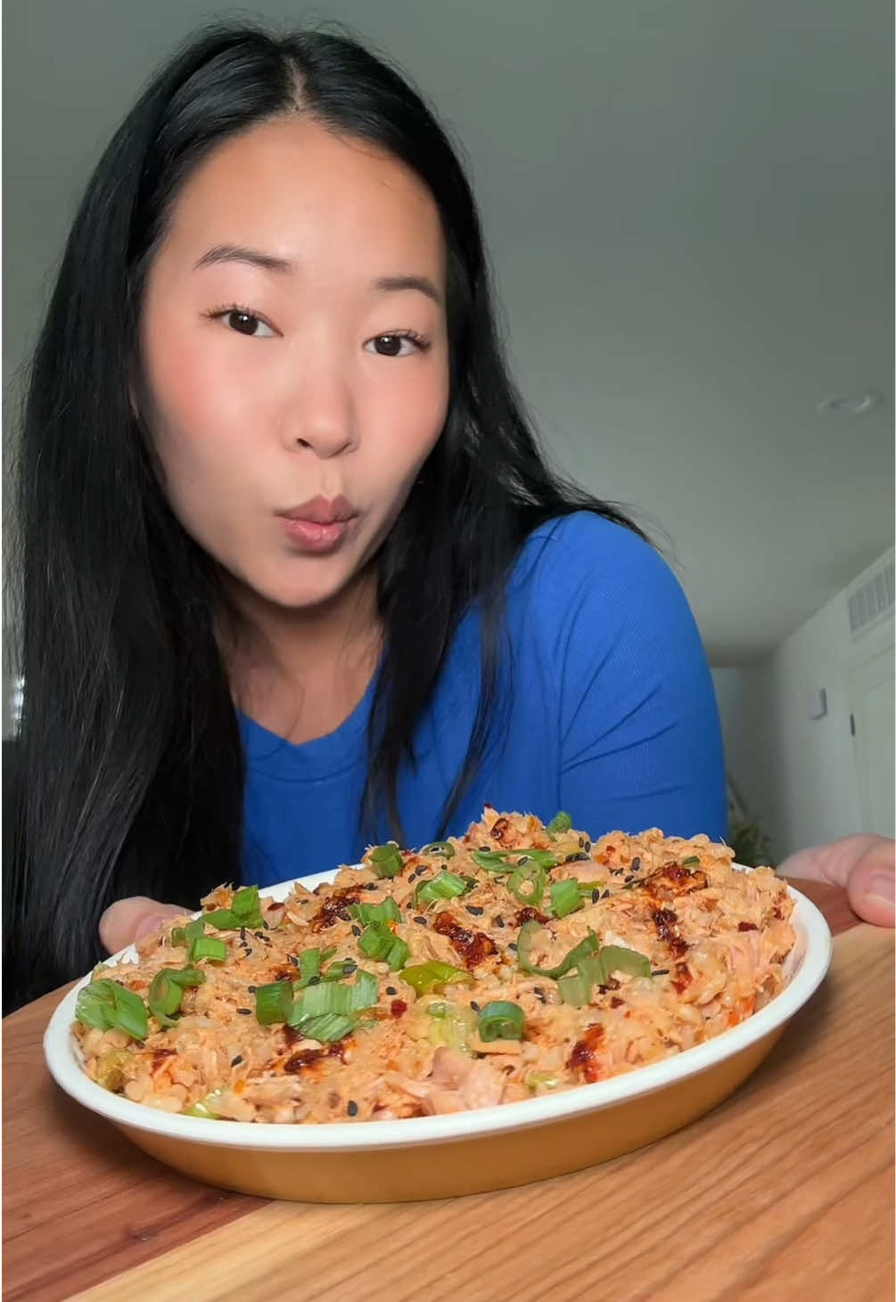 TikTok post by @biteswithesther for Momofuku. Caption reads: [...] the viral chili crunch sushi dip ft.....