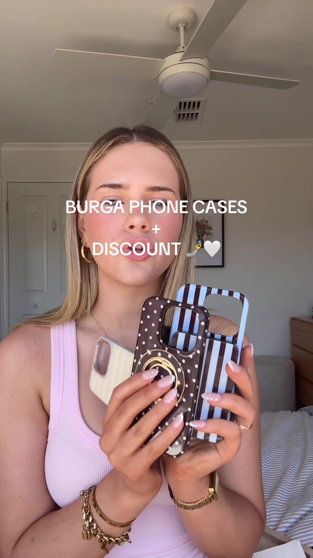 TikTok post by @izzytrodd for BURGA. Caption reads: Buy 2 @BURGA phone cases and get 2 free! Code....