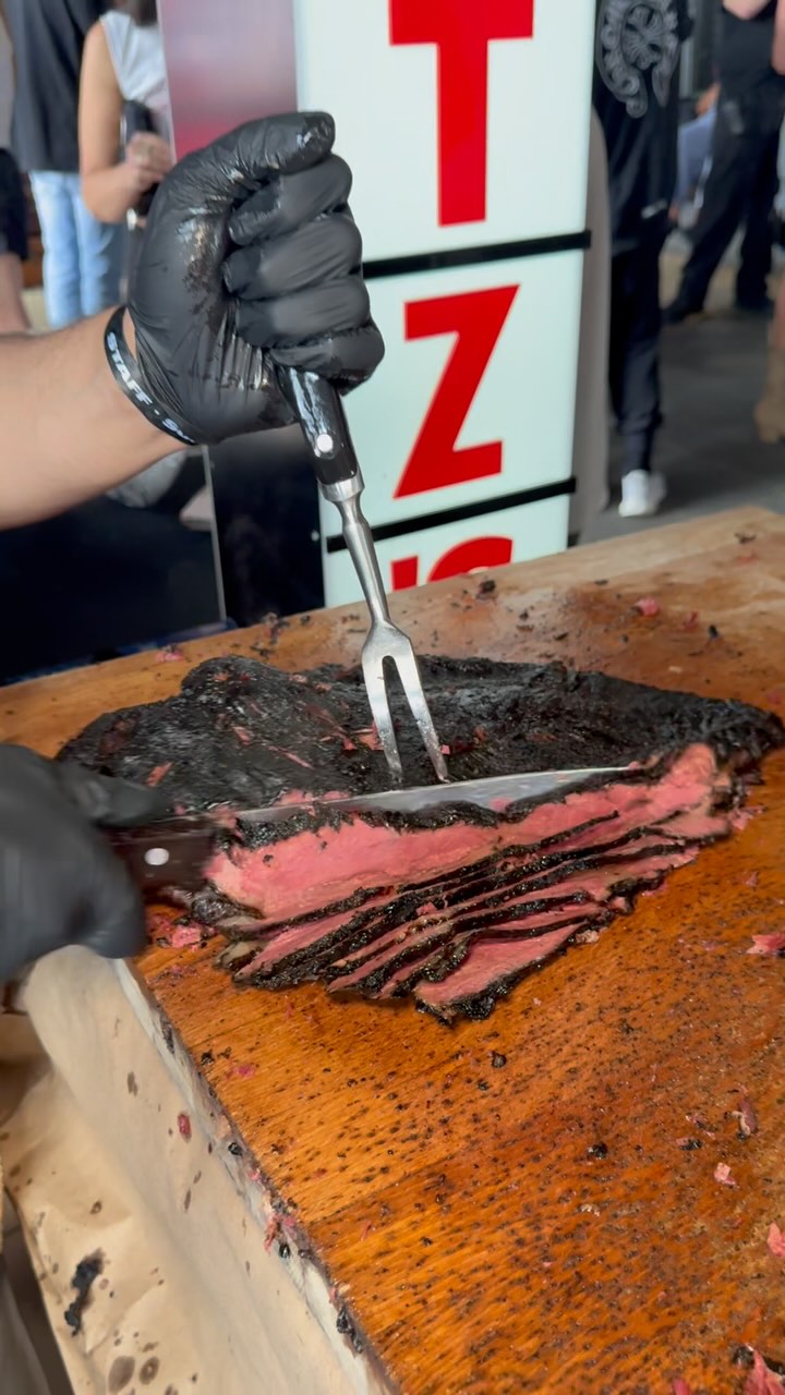 Instagram post by @yescheffoodfest for Verizon. Caption reads: Over 600 lbs of world famous @katzsdeli pastrami....