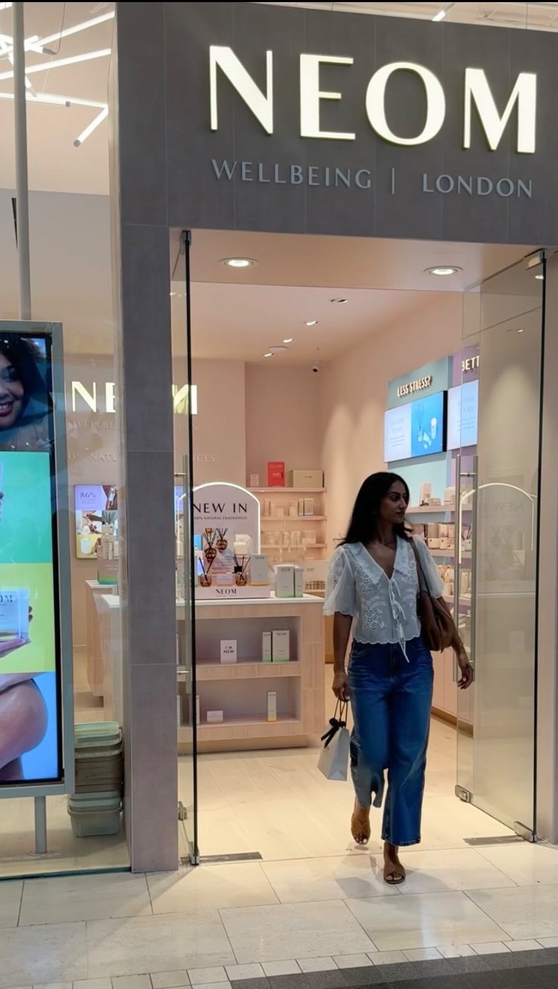 Instagram post by @kavveeta for Neom Wellbeing. Caption reads: 📍 @westfieldlondon White City 

Come shop at NEOM....