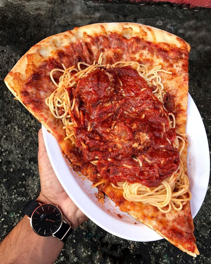 Instagram post by @mrbiggsmenu for Delish. Caption reads: SPAGHETTI N MEATBALLS PIZZA from @giamelas I....