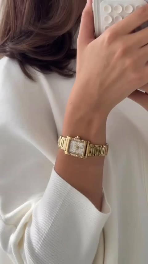 Instagram post by @ruba.tursun for DKNY. Caption reads: DKNY watches always level up my outfits. Don’t....