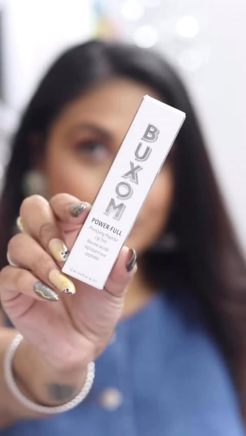Instagram post by @glambymitz for BUXOM Cosmetics. Caption reads: [...] Peptide Lip Tint - Rose Glaze by....