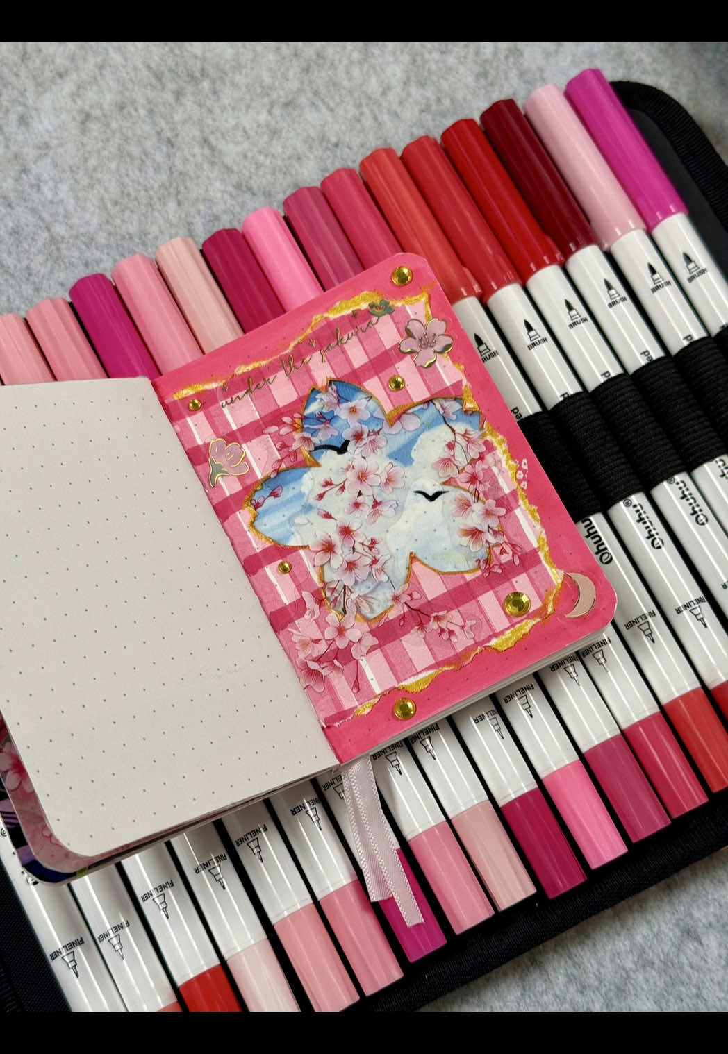 TikTok post by @tori_journal for Ohuhu. Caption reads: ASMR unboxing + journal page with Ohuhu....