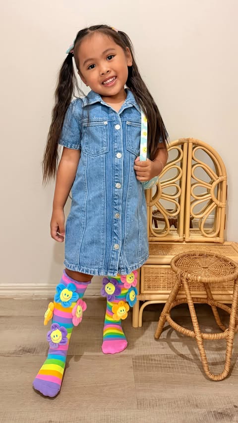 Instagram post by @amira.kelz_journey for MADMIA. Caption reads: [...] happy 🥹🌈💛 These colourful socks from....
