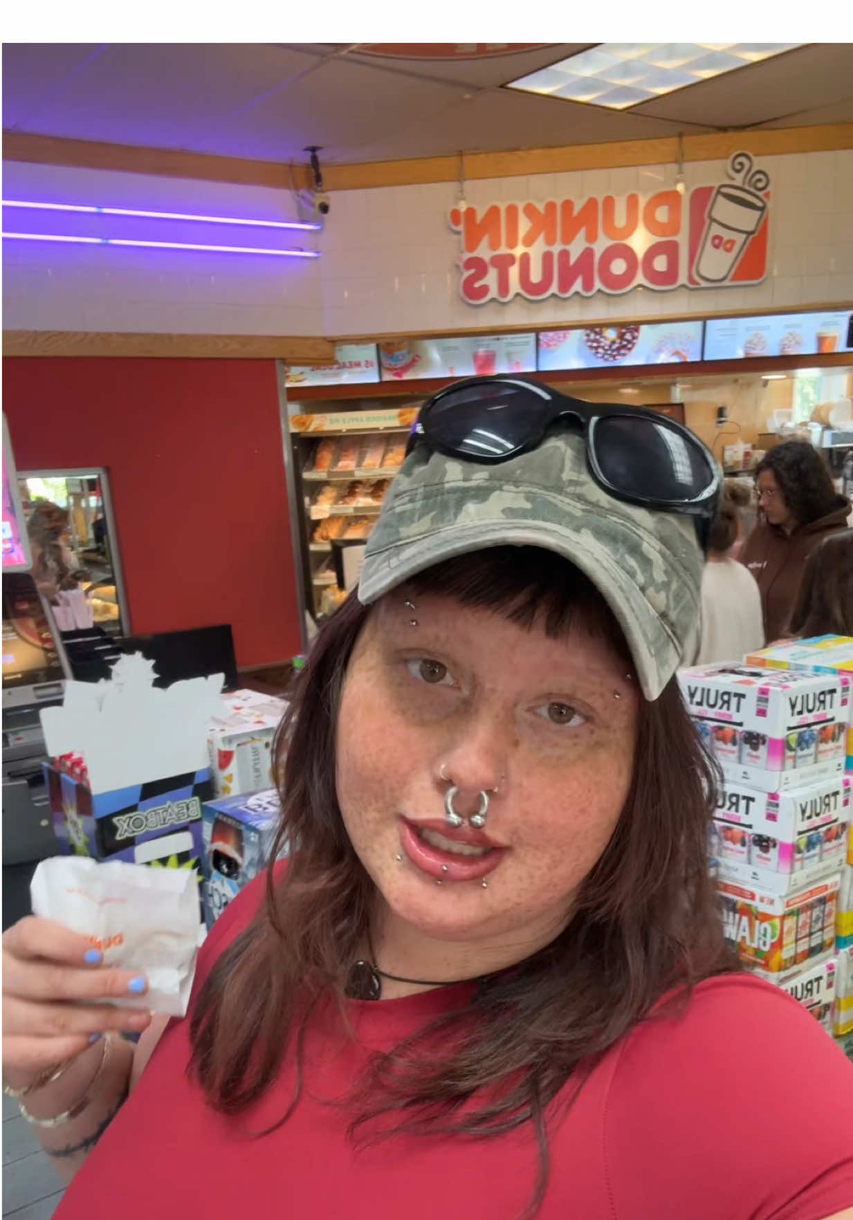 TikTok post by @phat.em for Shopdunkin. Caption reads: The new NEW ENGLAND @Dunkin' It girl!! What are....