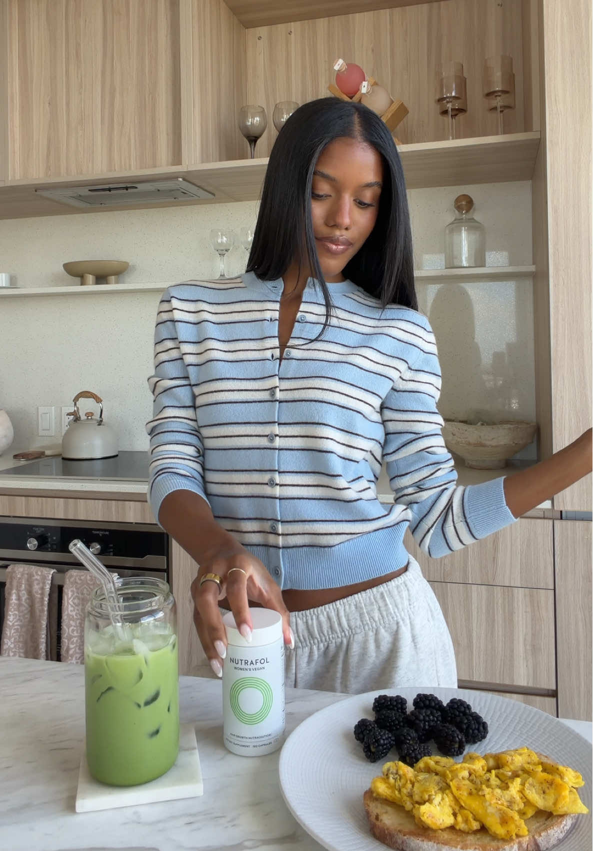 TikTok post by @shaniachristinad for Nutrafol. Caption reads: [...] to begin with 🍵 most importantly? my....