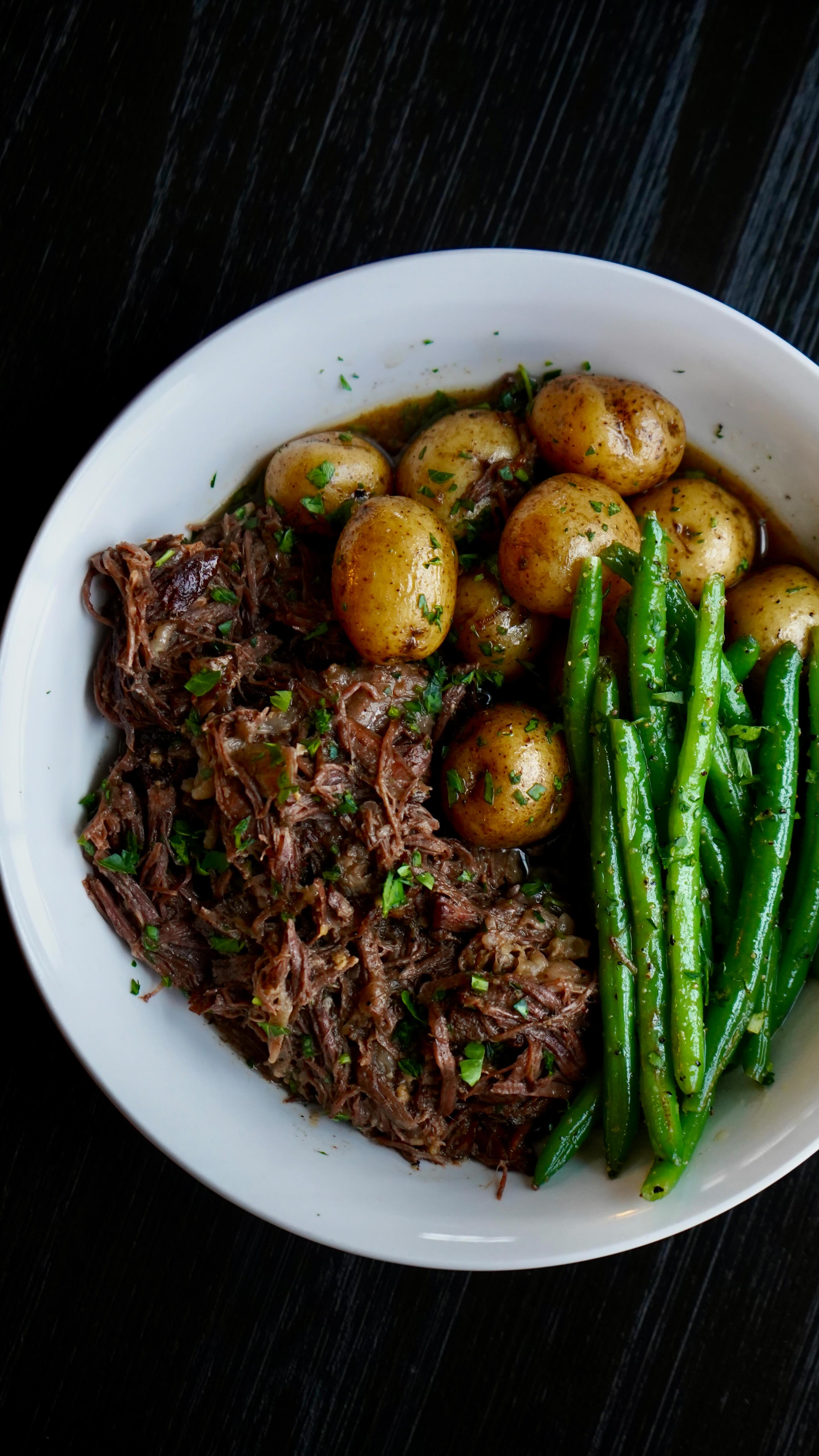 Instagram post by @calwillcookit for Miller Lite. Caption reads: Comfort Classics Pt. 1 | Beer Braised Chuck Roast....