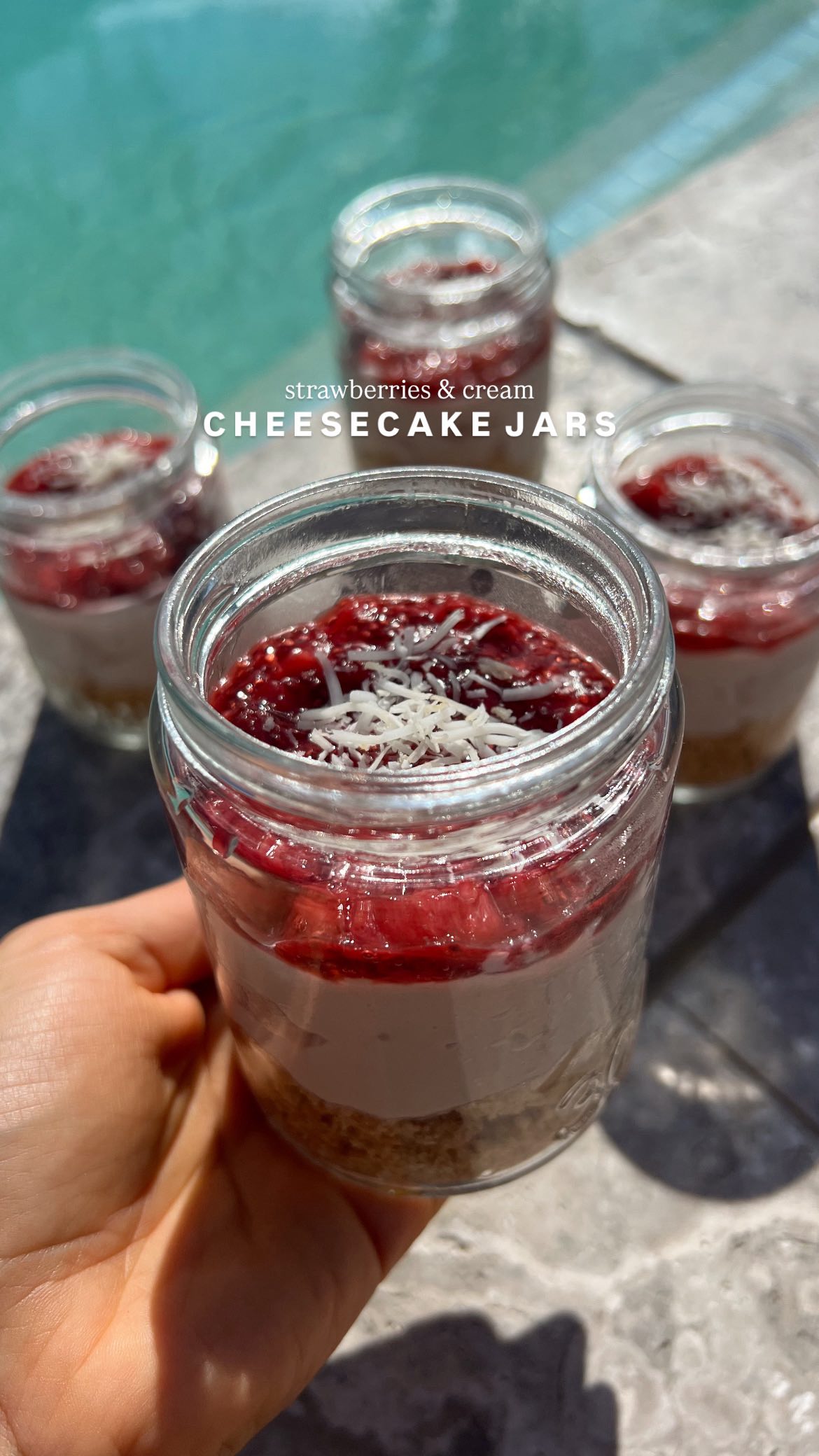 Instagram post by @nutrition.by.kayla for Cocobella. Caption reads: STRAWBERRIES & CREAM CHEESECAKE JARS 🍓🥥🤍

A....