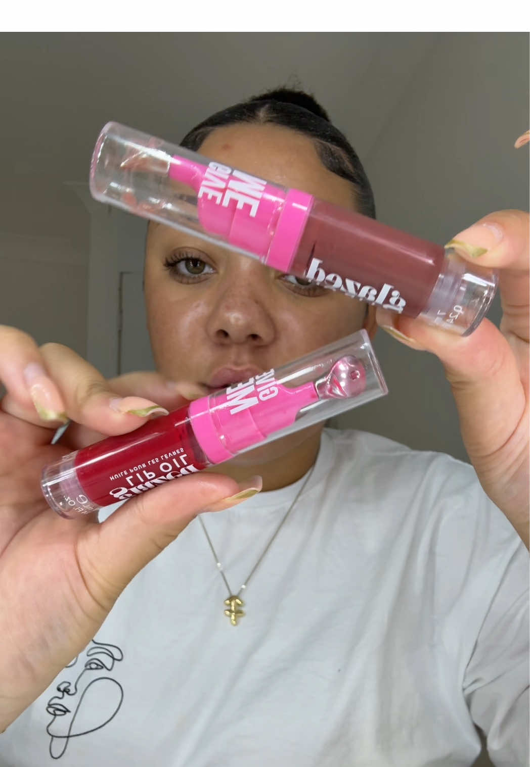 TikTok post by @shinyefinds for Give Me Cosmetics. Caption reads: Give me, ATE💋✨ @Give Me Cosmetics #lipoil....
