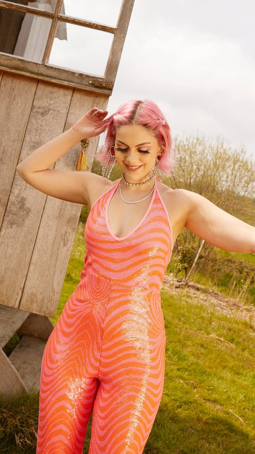 Instagram post by @sophiehannah for Skinnydip London. Caption reads: ad ✨🦋🌈 Sophie Hannah X @skinnydiplondon summer....