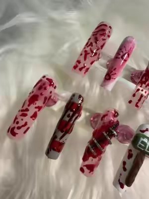 TikTok post by @babyyykatelynnn for GAOY. Caption reads: [...] book your halloween set 🔪 ! products....