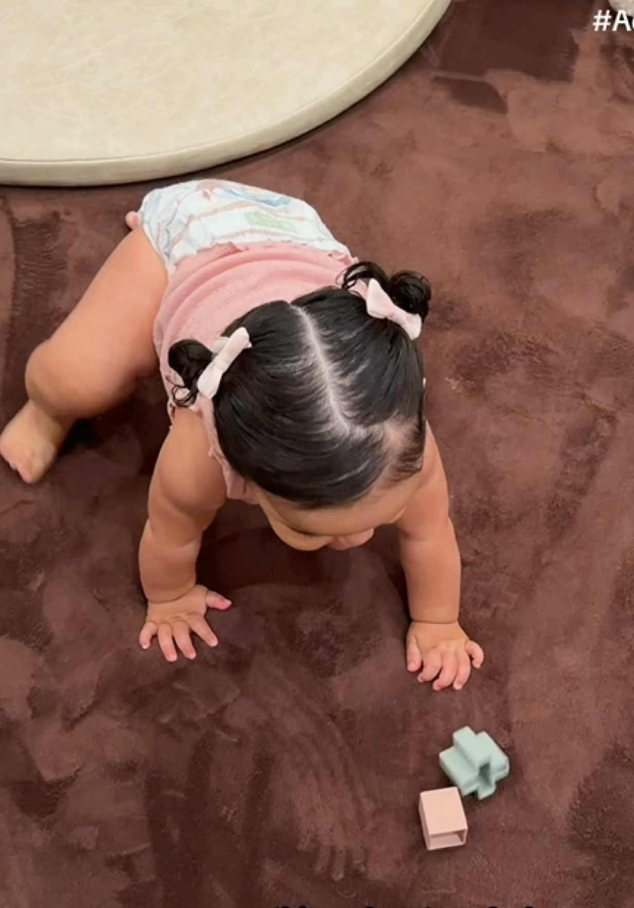 TikTok post by @theerealkarlaj_ for Huggies. Caption reads: #ad She may not be walking yet, but she’s already....
