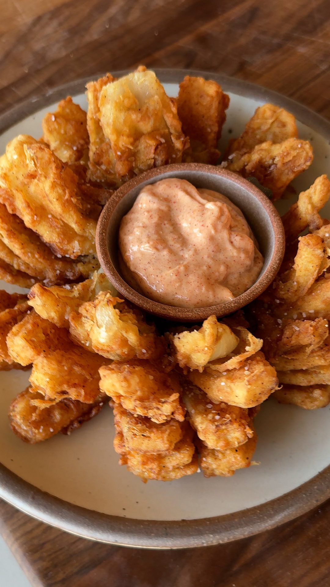 Instagram post by @noahtanen for Food52. Caption reads: @noahtanen took on the Bloomin’ Onion so you don’t....